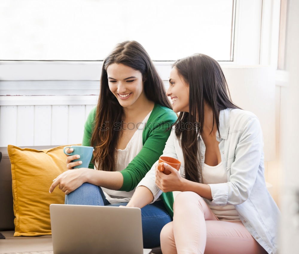 Similar – Image, Stock Photo Overhead photograph of two beautiful young women at home sitting on sofa while using a tablet PC computer and smiling
