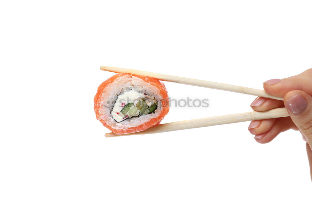 Similar – Closeup of woman chef cutting japanese sushi roll