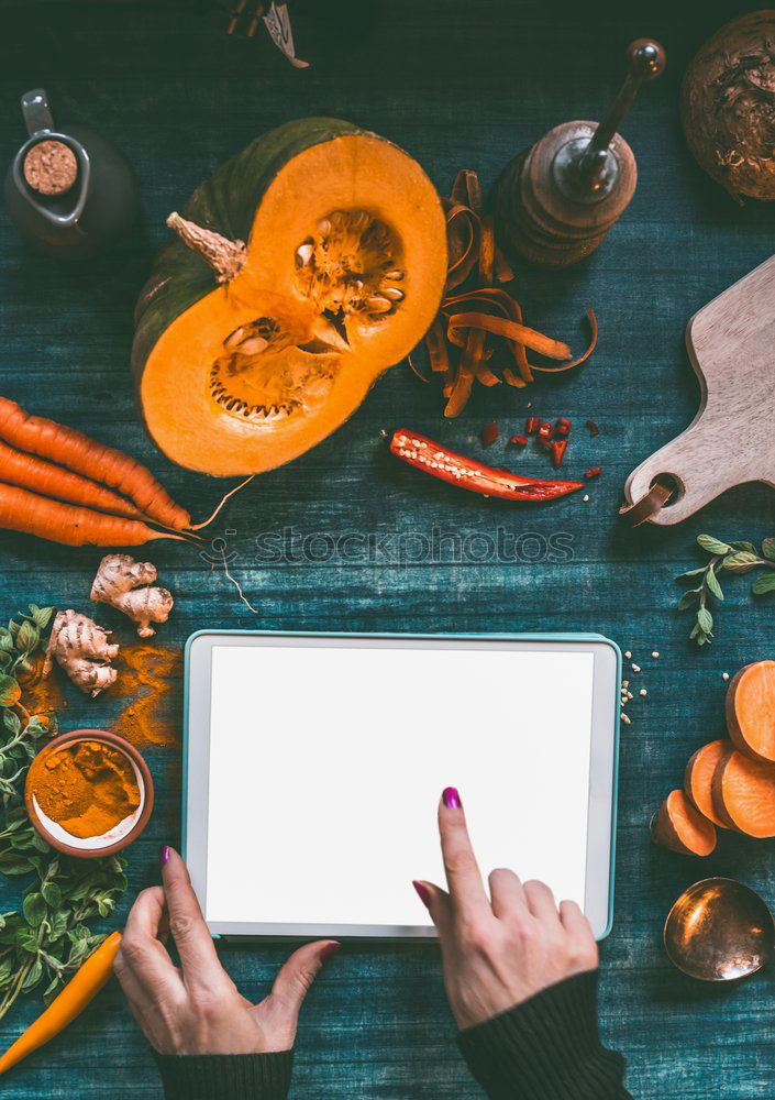 Image, Stock Photo Hands with tablet PC on kitchen table with pumpkin