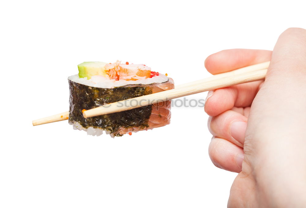 Similar – Closeup of woman chef cutting japanese sushi roll