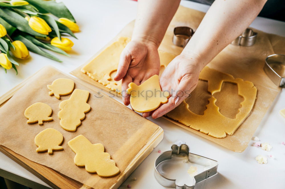 Similar – woman in bakery preparing sweets adding egg