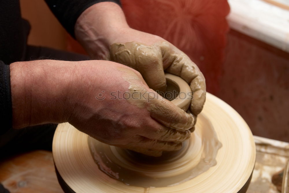 Similar – Female hands forming clay pot