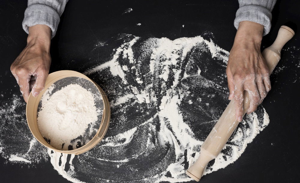 Similar – Hands of woodcarver make wooden bowl