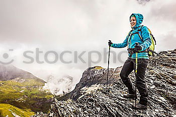 Similar – Foto Bild Frau mit Rucksack und Wanderstöcke