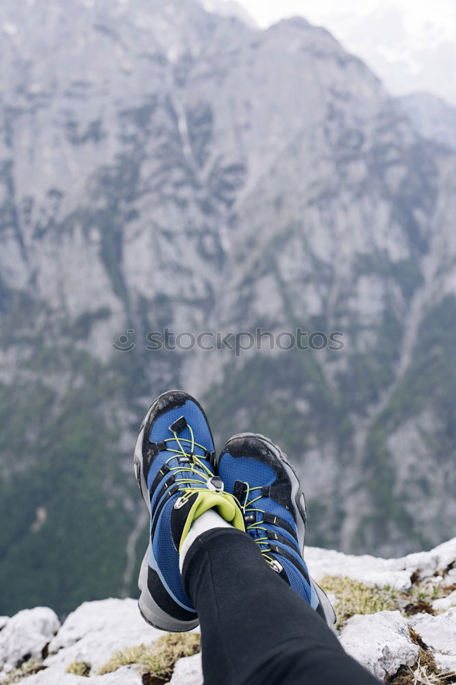 Similar – 2 people hiking show their hiking boots