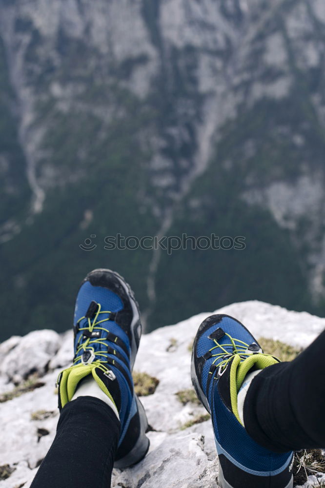 Similar – 2 people hiking show their hiking boots