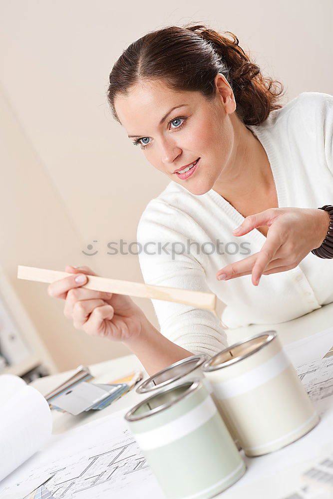 Similar – Image, Stock Photo Young female sitting by table and making clay or ceramic mug in her working studio