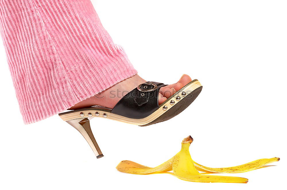 Similar – Long legs of a woman is the main subject of this image. She is relaxing in a milk bath with her red avant-garde shoes on. Golden cards and golden crane accompany her with these high fashion shoes.