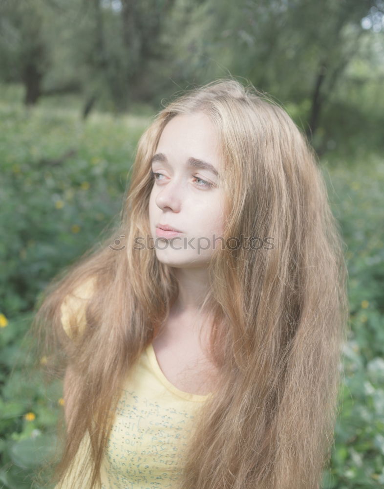 Portrait of a young slender woman in the forest