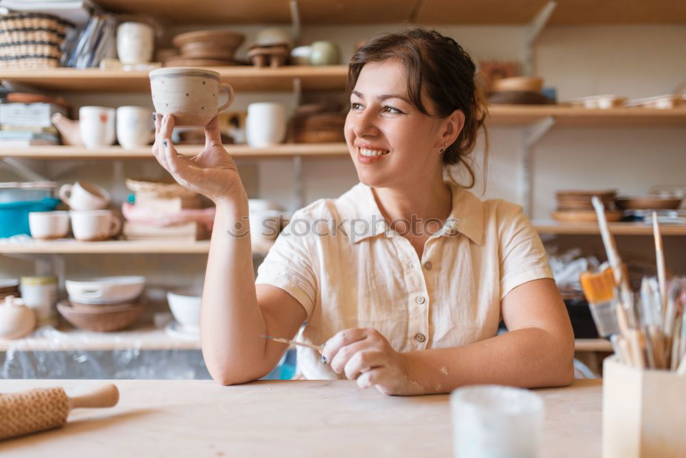 Similar – Image, Stock Photo Beautiful ceramist owner looking to the camera while smiling