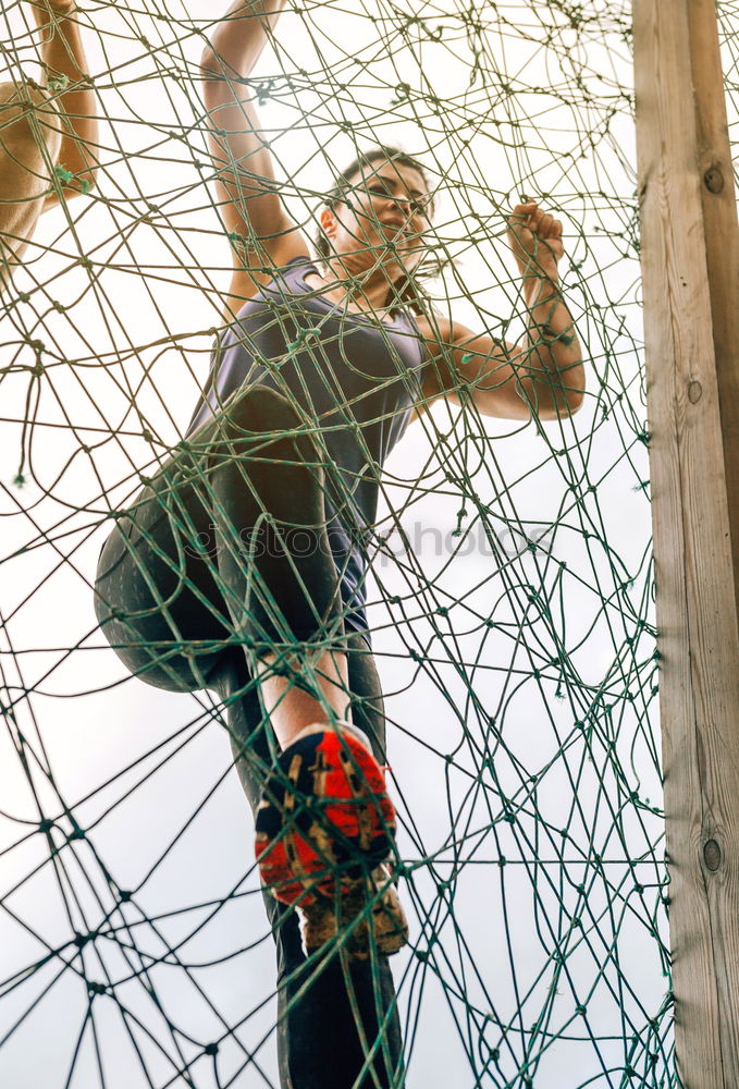 Similar – Woman with afro hair climbing by children’s attractions.