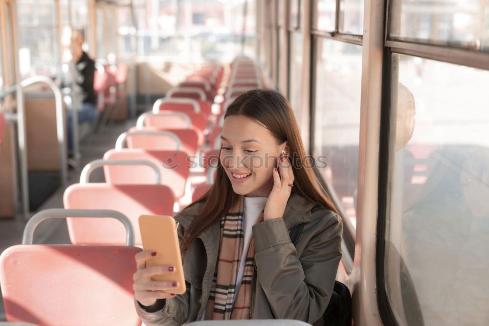 Similar – Image, Stock Photo Young woman with mobile phone at train station