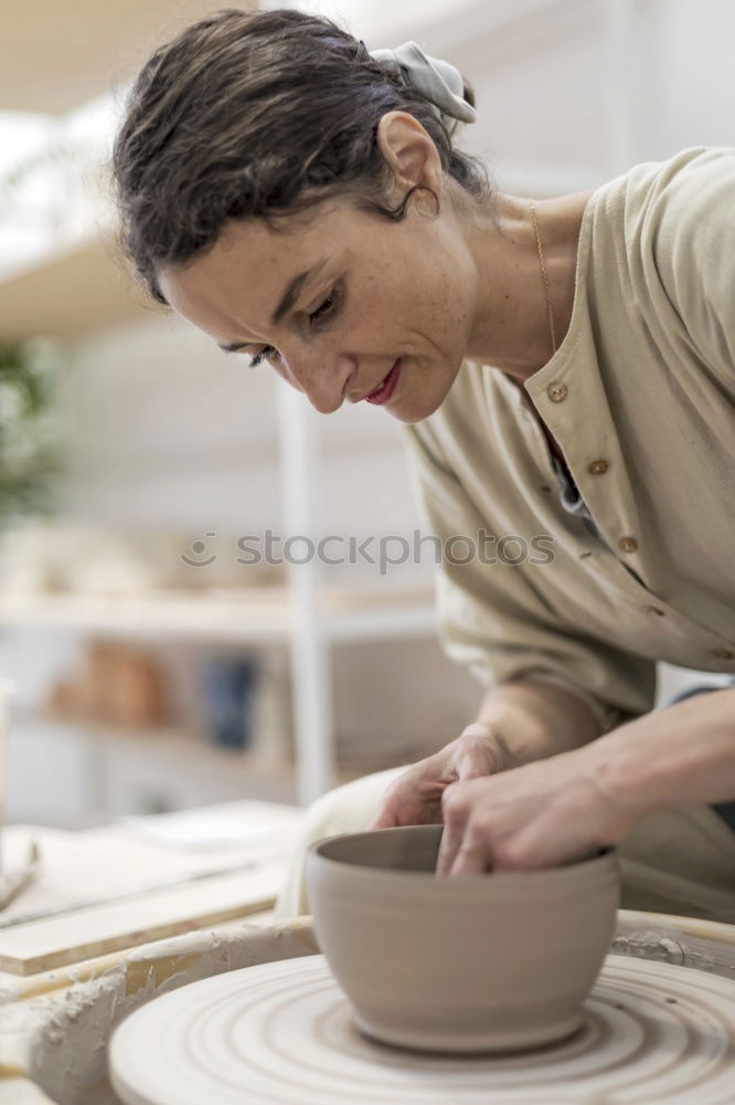 Similar – Image, Stock Photo Beautiful ceramist owner looking to the camera while smiling