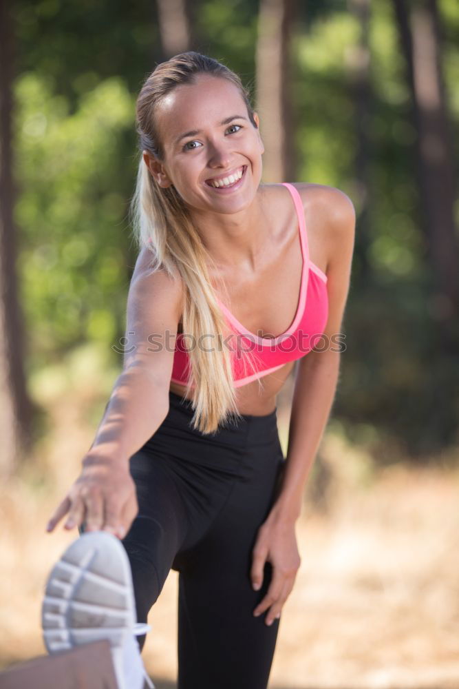 Similar – Woman stretching her body in front of ancient wall in park