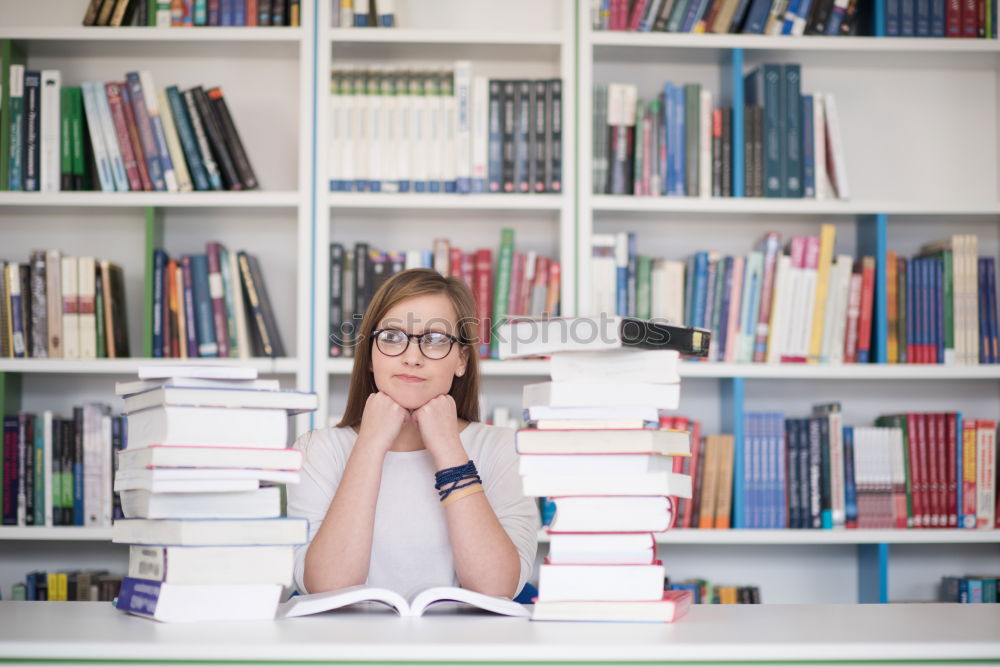 Similar – Student girl in a library