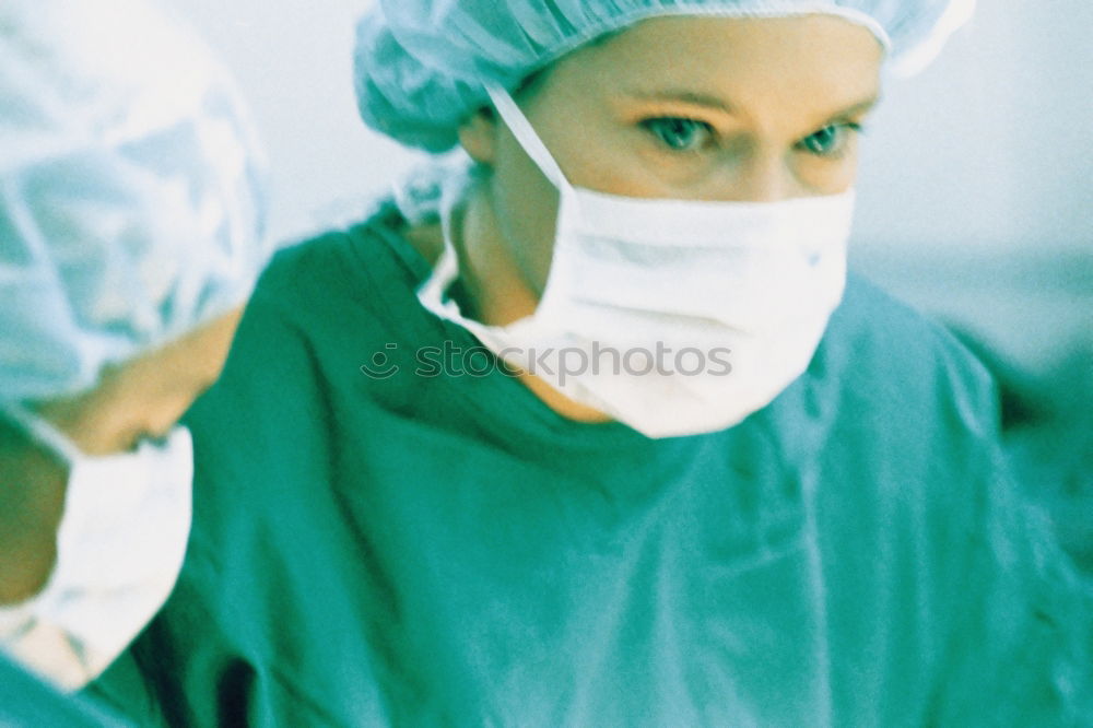 Similar – Image, Stock Photo Team of Surgeons Operating.