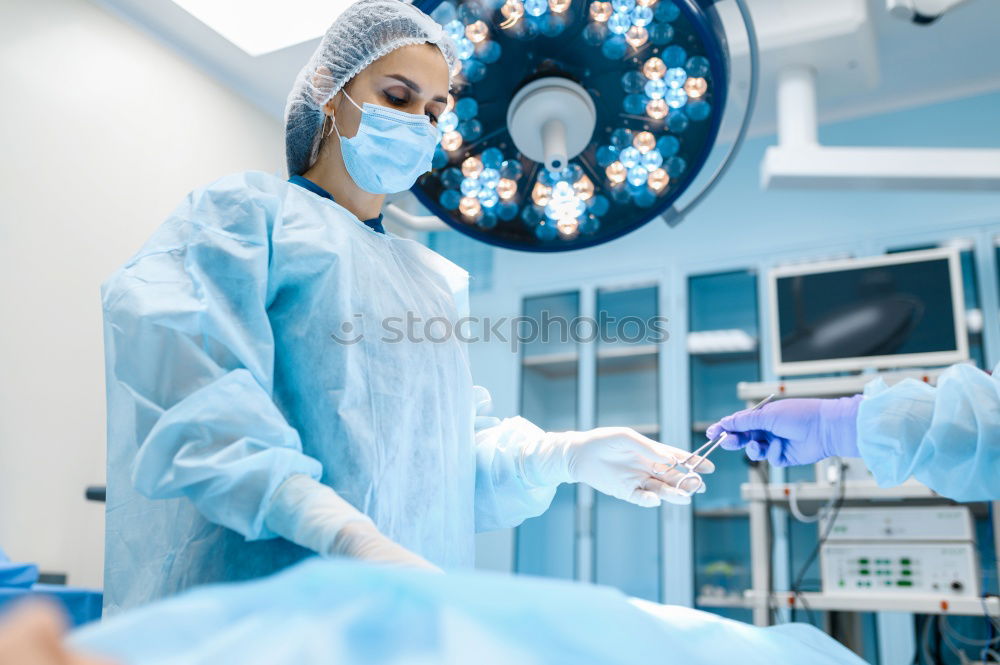 Similar – Image, Stock Photo Team of Surgeons Operating.