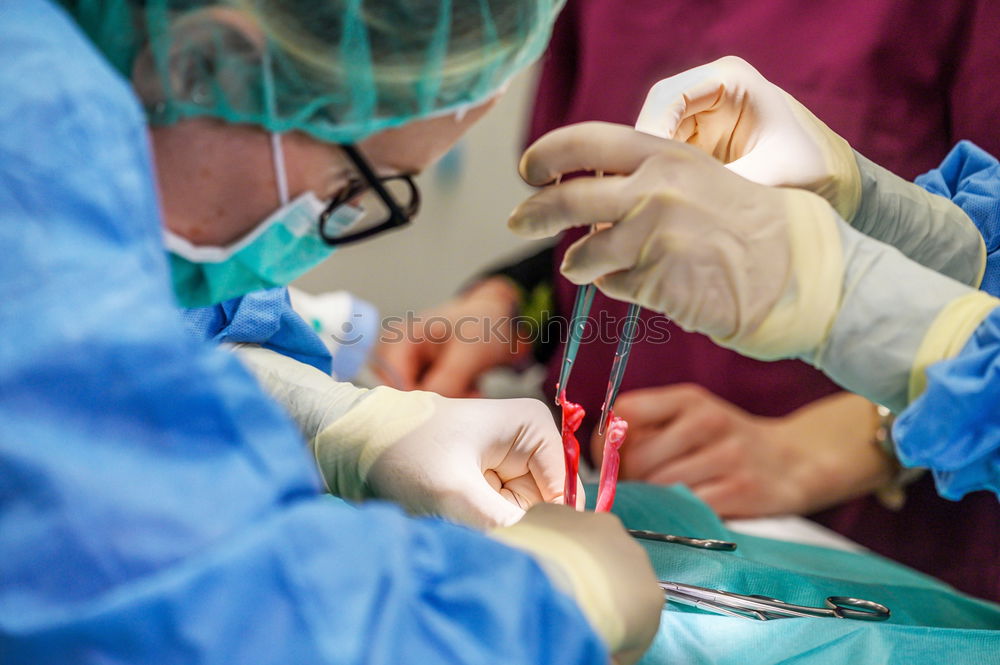 Similar – Image, Stock Photo Team of Surgeons Operating.