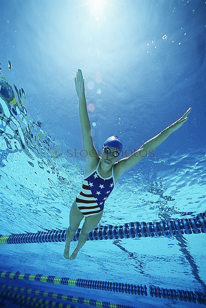 Similar – Unterwasseraufnahme. Körper  einer schlanken  jungen Frau Im Badeanzug  im Schwimmbecken