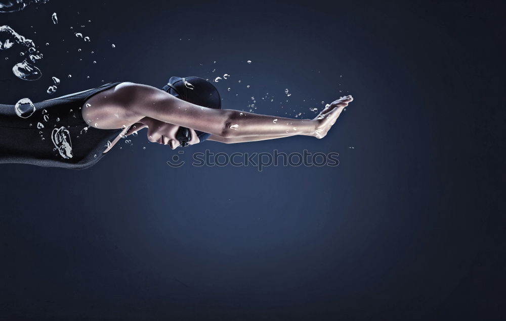 Similar – Athletic man balancing on gymnastic rings