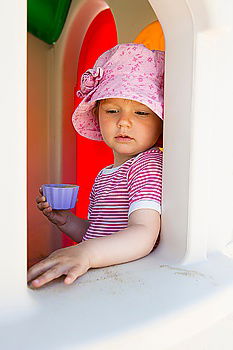 Similar – Young boy talking to the phone in a yellow telephone booth