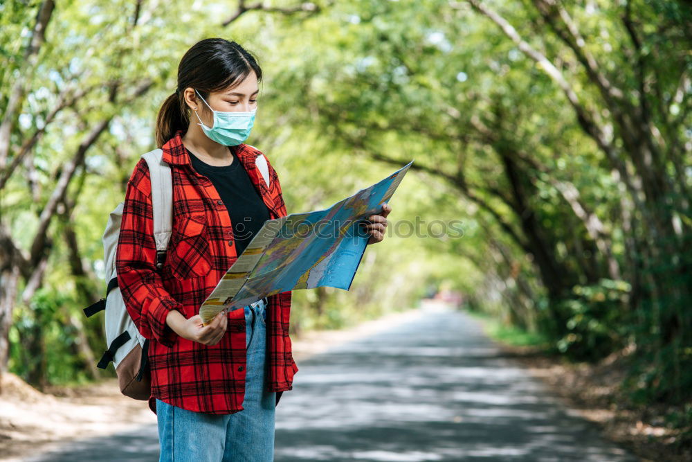 Similar – Image, Stock Photo Man navigating on road in woods