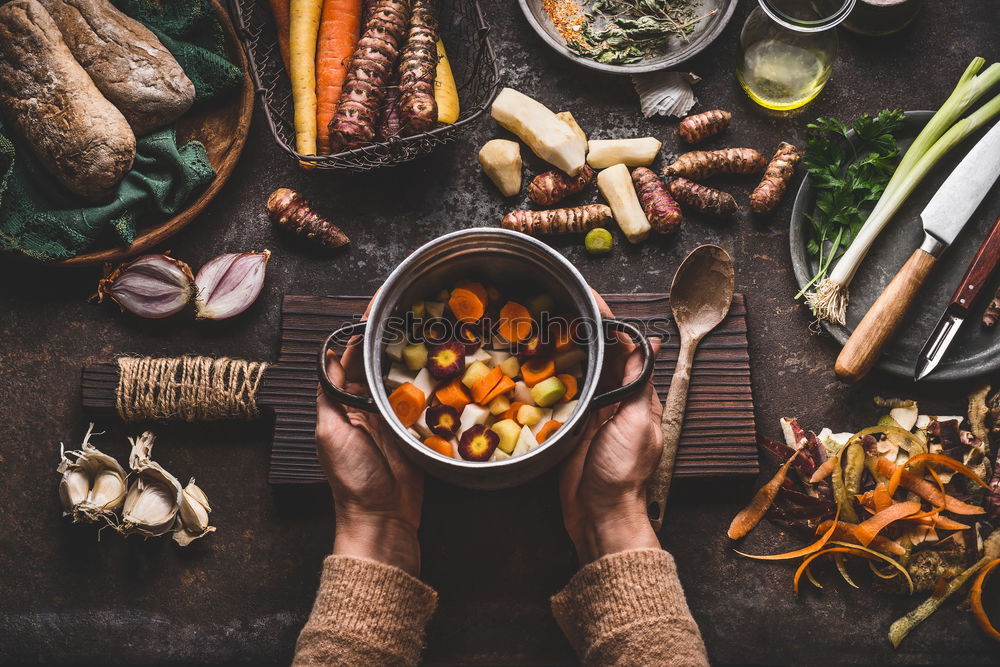 Similar – Image, Stock Photo Female hands hold small wok pot with chopped vegetables