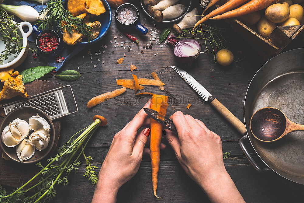 Similar – process of cutting slices of fresh carrots