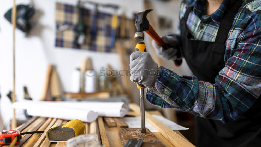 Metal grinding on steel spare part in workshop.