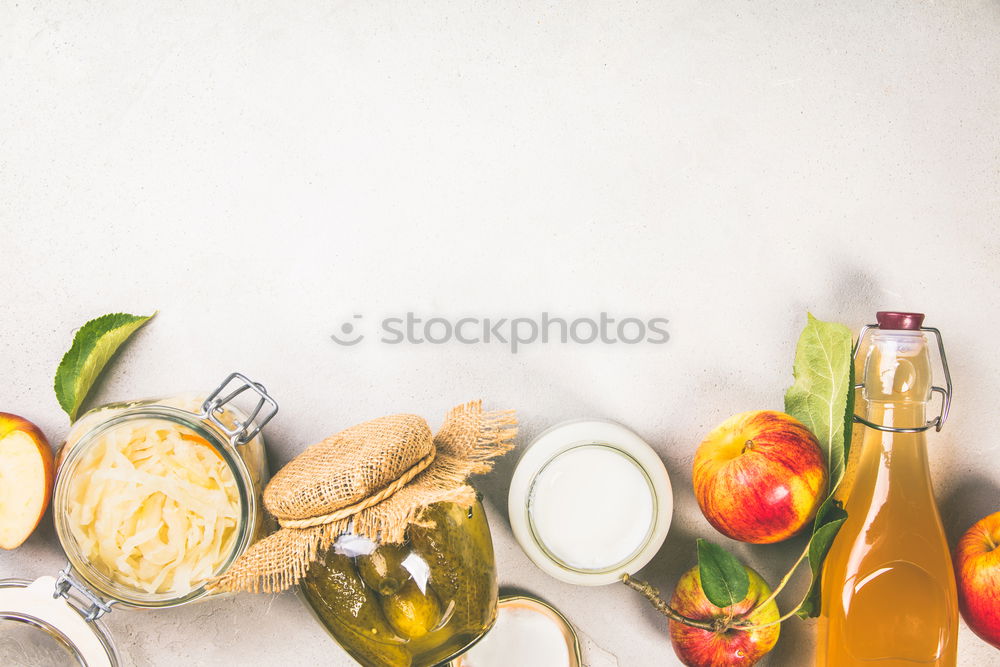 Similar – female hands holding a jar with a glass of fresh carrot juice