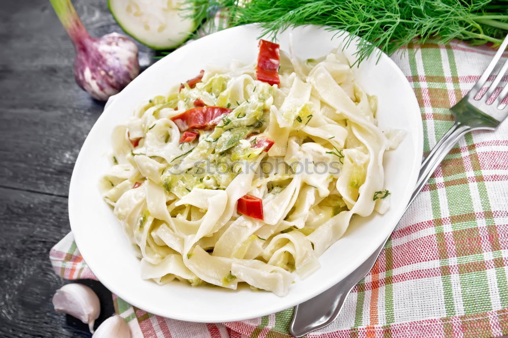 Spaghetti Carbonara in a green plate