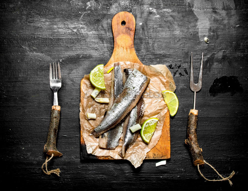 Similar – Fresh fish smelt spices for cooking on a kitchen board