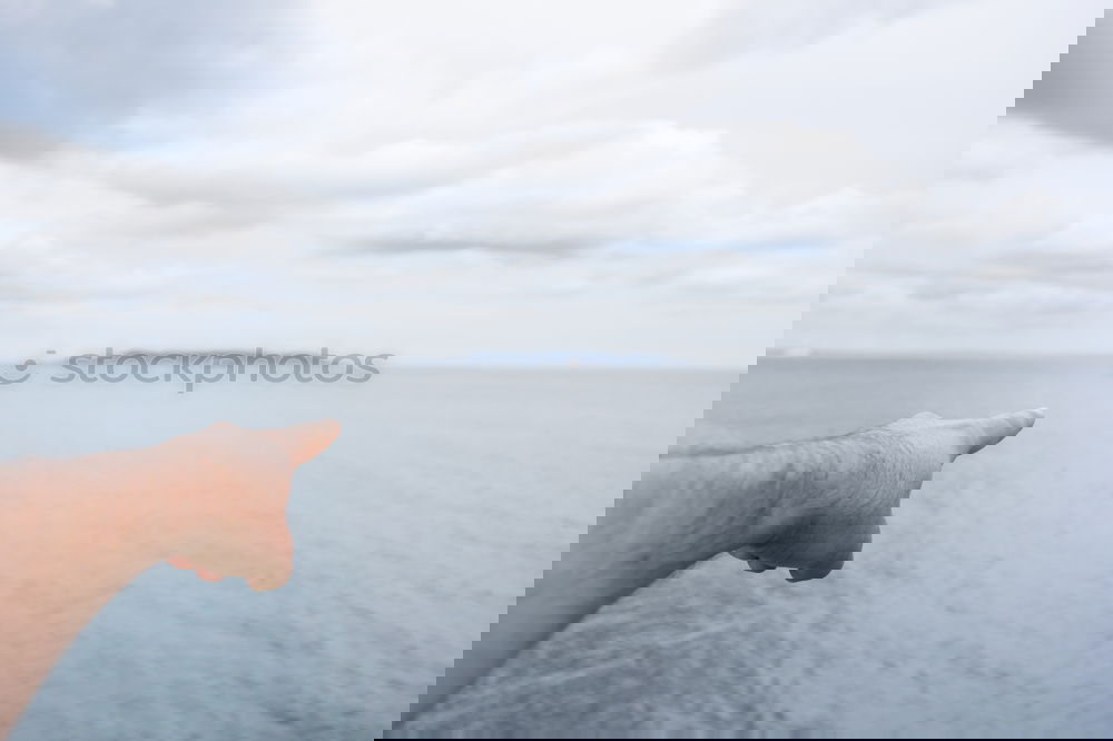 Image, Stock Photo Crop male hand on background of ocean