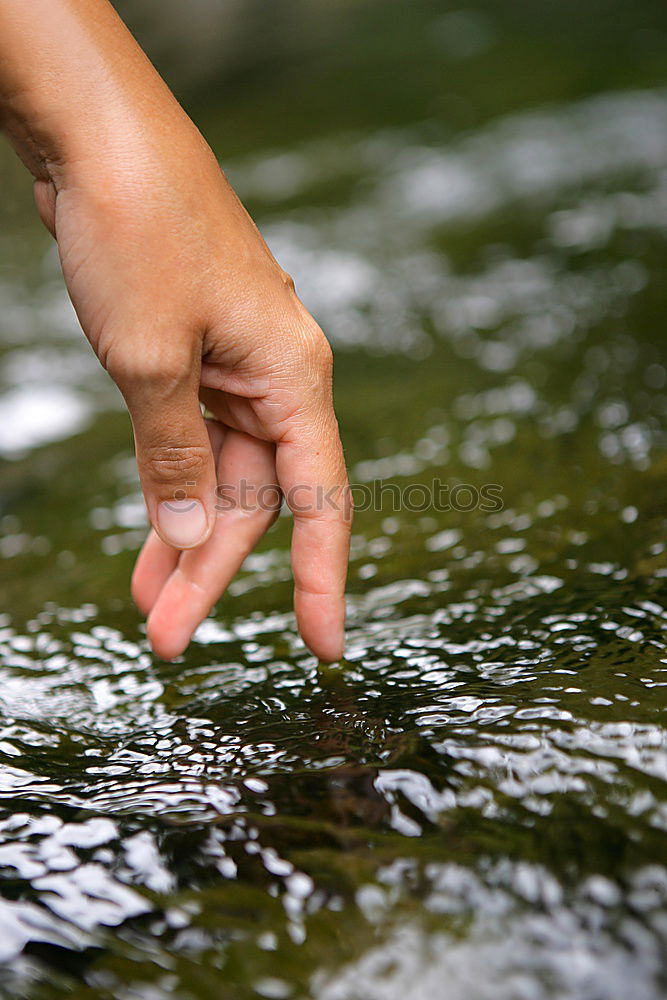 Similar – Image, Stock Photo Hand touching fresh water in a lake