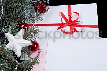 Similar – Image, Stock Photo Two gift wrapped in paper with a red ribbon on a white plate
