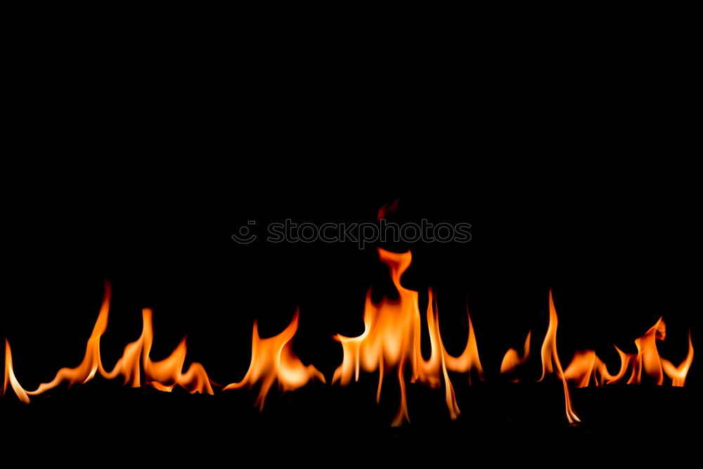 Similar – Close-up of a single flame.