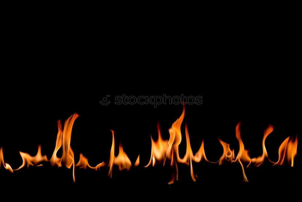 Similar – Close-up of a single flame.