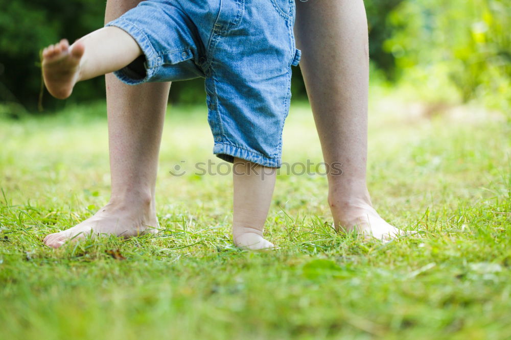 Similar – Image, Stock Photo Feet on the street in front of the meadow