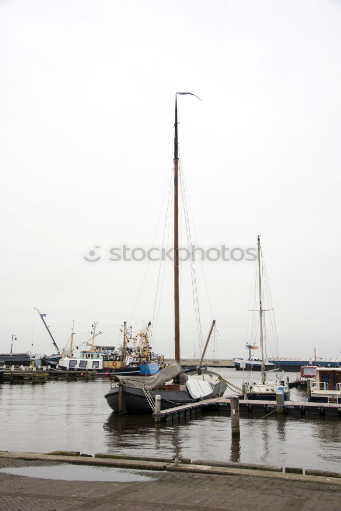 Similar – Fishing flags, sea, jetty