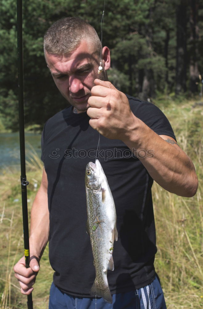 Similar – Fisherman caught a fish