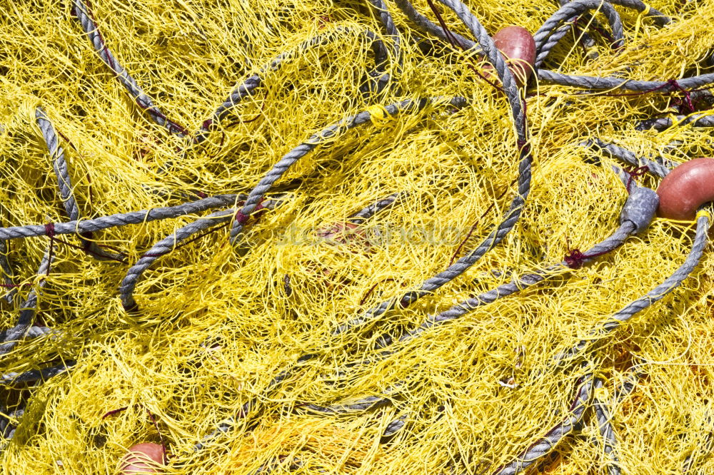 Fishnets on fish boat. Yellow net.