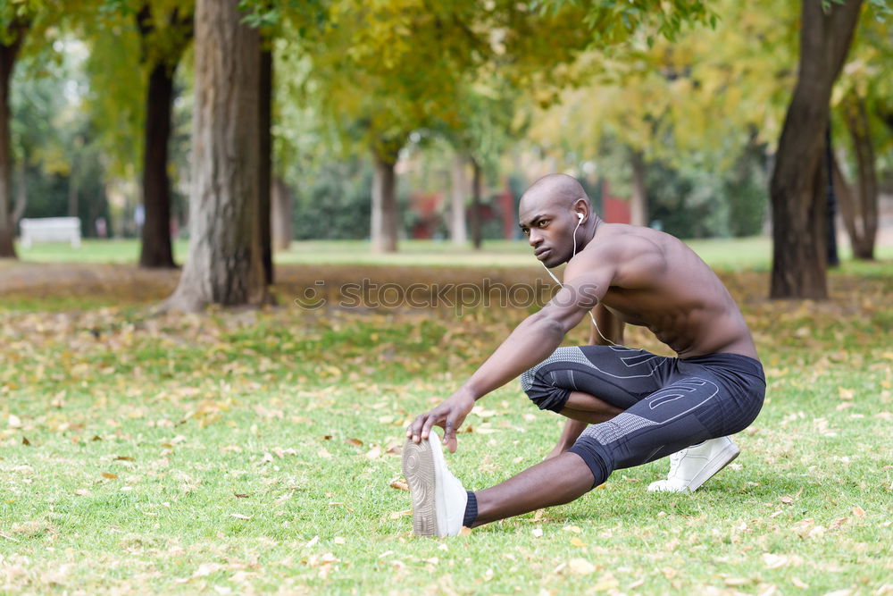 Similar – Image, Stock Photo Fit shirtless young black man doing legs stretching