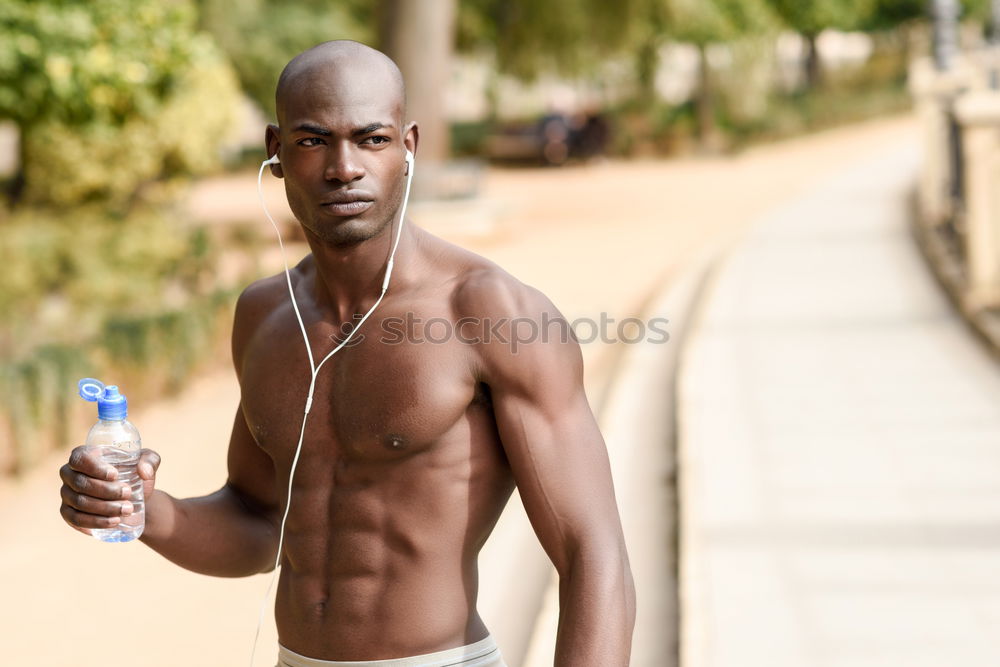 Similar – Black man running and listening to music in urban background