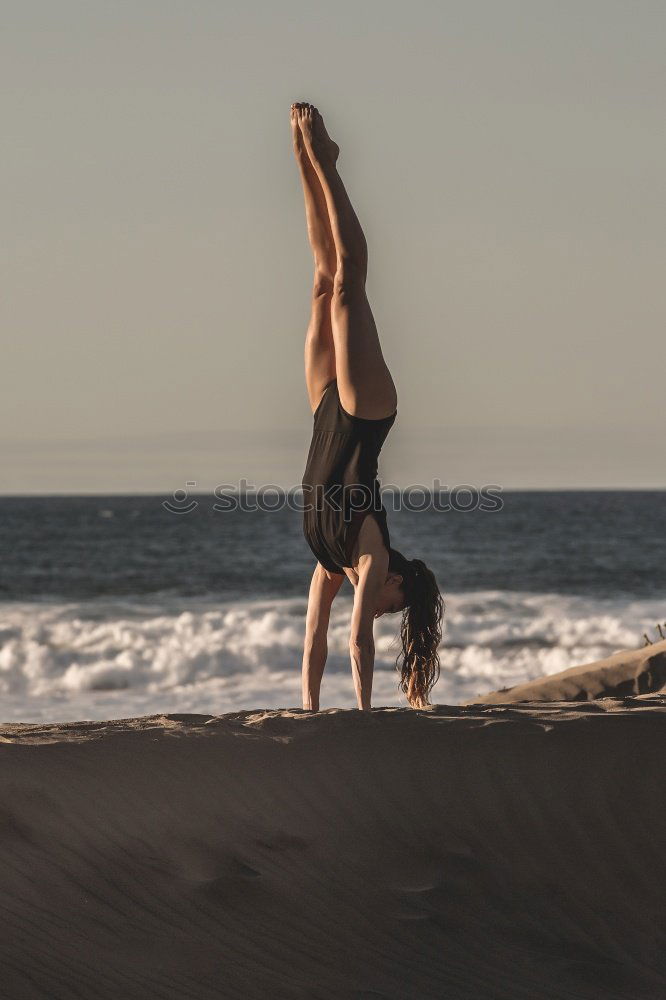 Similar – Athletic man balancing on gymnastic rings