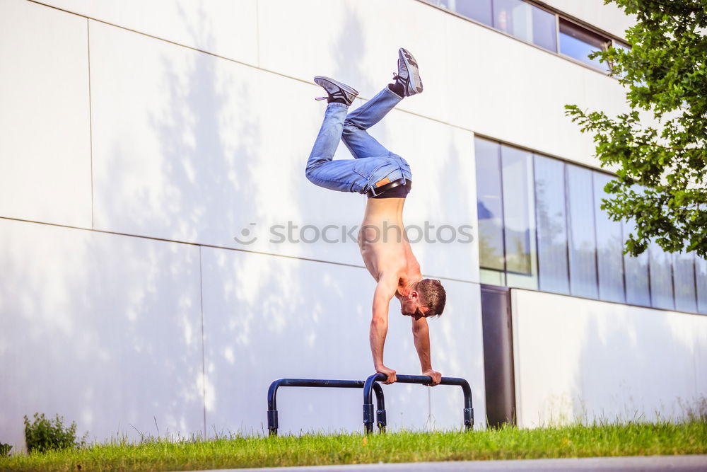 Similar – Woman jumping barefoot over blue rubber hills