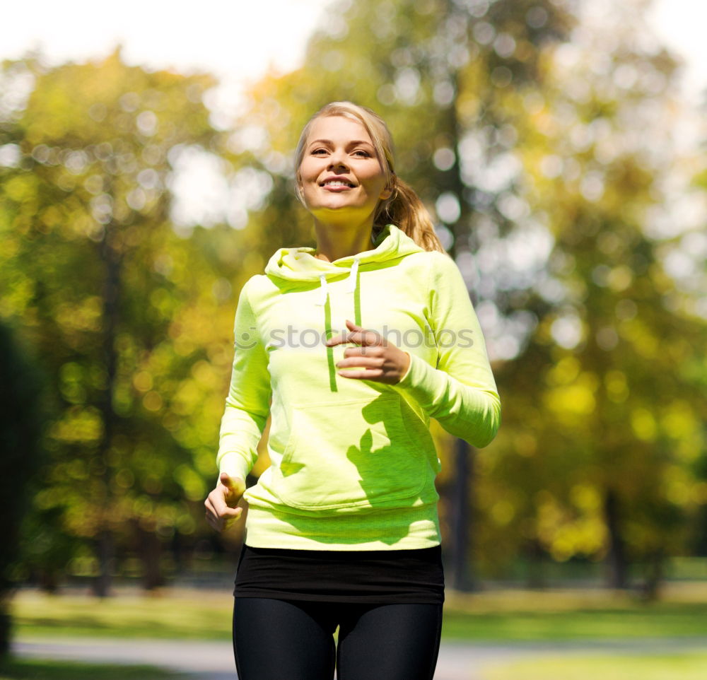 Similar – Pretty Woman Jogging at the Park with Headphones