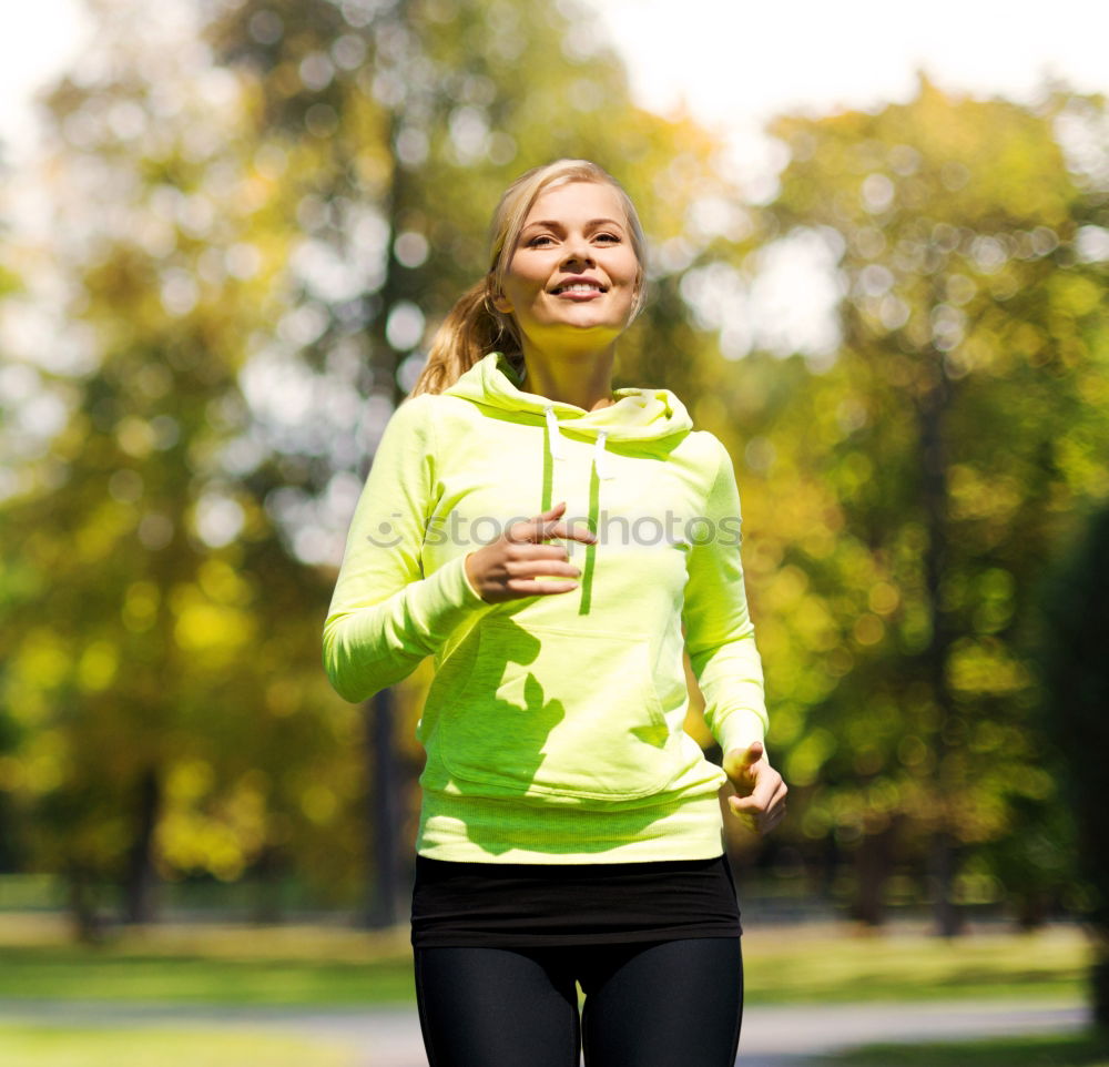 Similar – Pretty Woman Jogging at the Park with Headphones