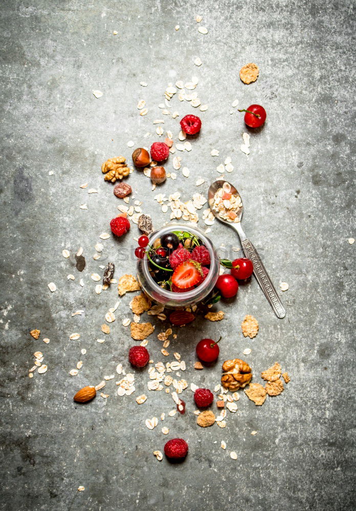 Similar – Healthy breakfast with fresh berries, muesli and nuts