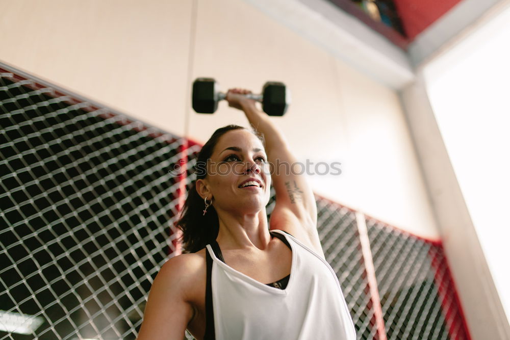 Similar – Athletic woman training in gym