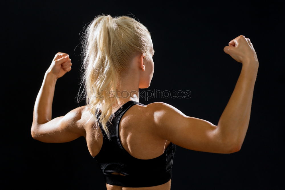 Similar – Close up side view profile portrait of one young athletic woman shadow boxing in sportswear in gym over dark background, looking away